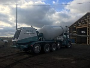 Taking advantage of the mild weather to lay some concrete for the new building!