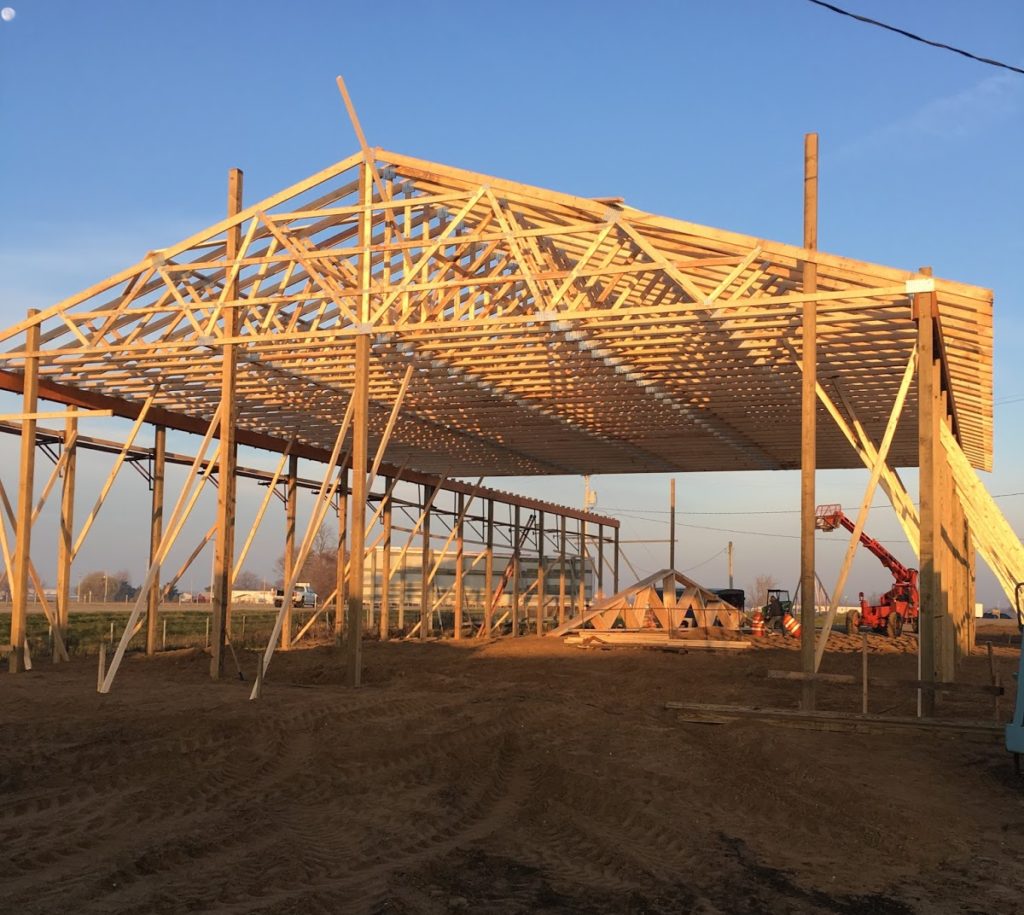 Support posts are in and trusses are up! Finally, it is beginning to take shape and resemble a building!