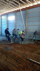 Mark Wright, along with Alt Oil employees and builders from Coopersville Construction, all come together in an attempt to beat mother nature and install the concrete slab floor on a cold Michigan winter day.